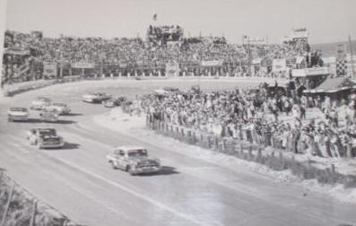 Beach racing at Daytona in 1957 in Ray Nichels Pontiac #8. Out of the North Turn