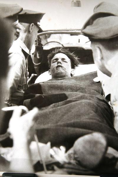 Bernie Hentges is seen being carted away on a stretcher after a racing crash in 1957. 